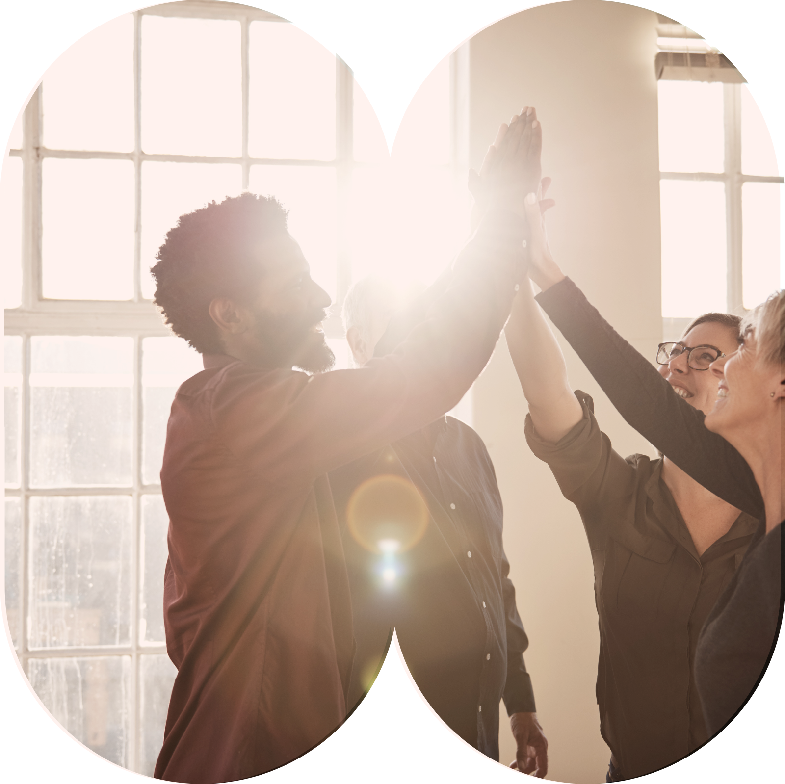 A life sciences team celebrating with a high five